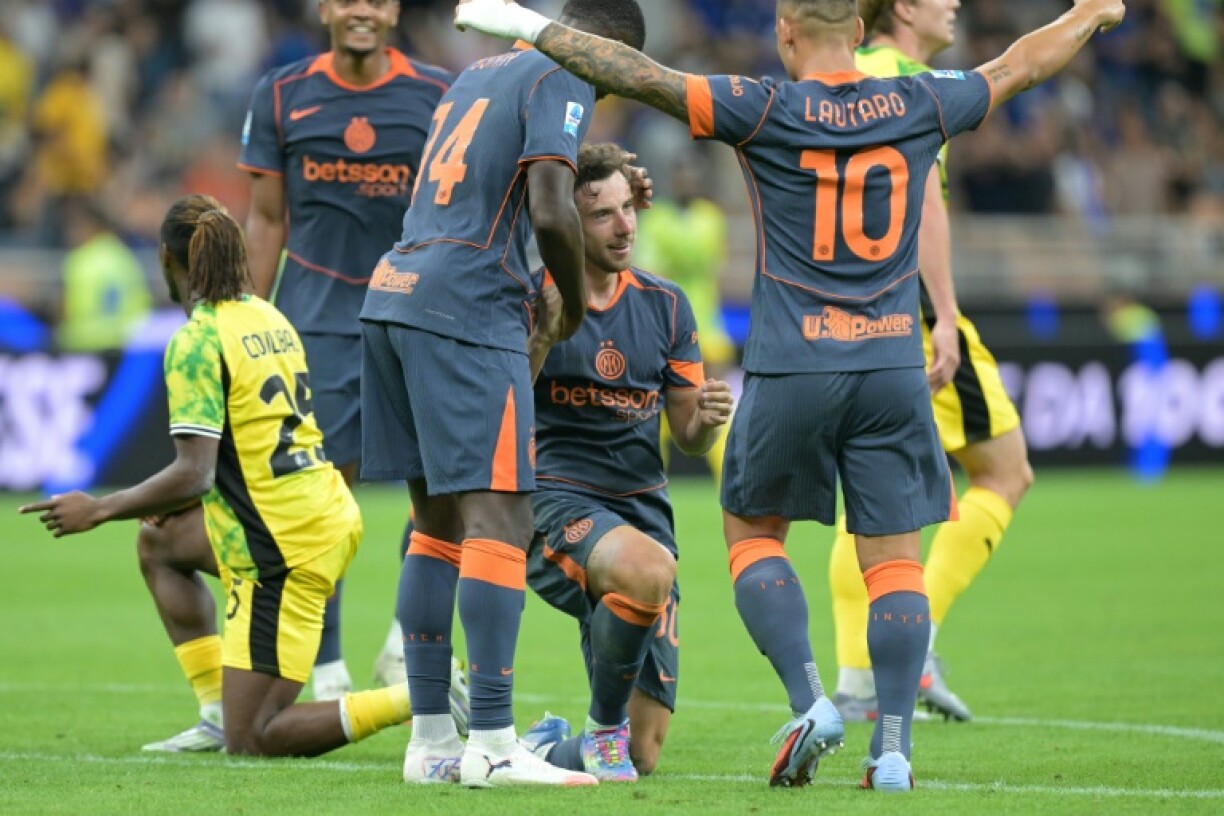 Brazilian Carlos Augusto's (C) deflected strike proved the matchwinner for Inter Milan