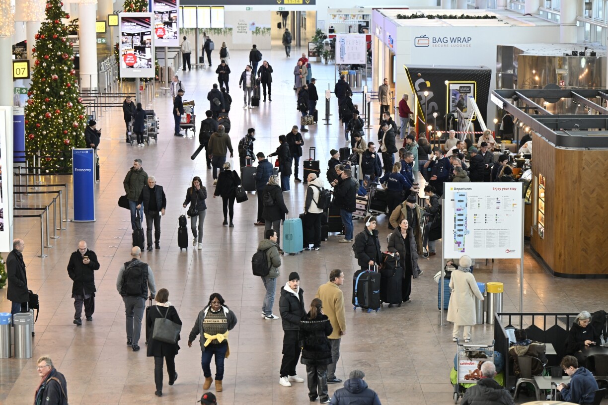 Travelers pictured during a strike at Brussels Airport, in Zaventem, Monday 13 January 2025. The strike is part of a national day of action to protest against the planned pension reforms of the ongoing federal government negotiations.