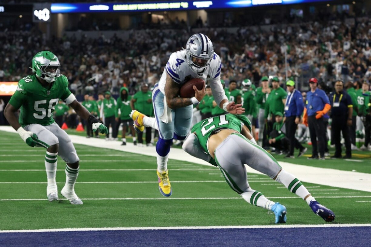 Dallas Cowboys quarterback Dak Prescott dives into the end zone for a touchdown in a thrilling 24-21 win over the Philadelphia Eagles