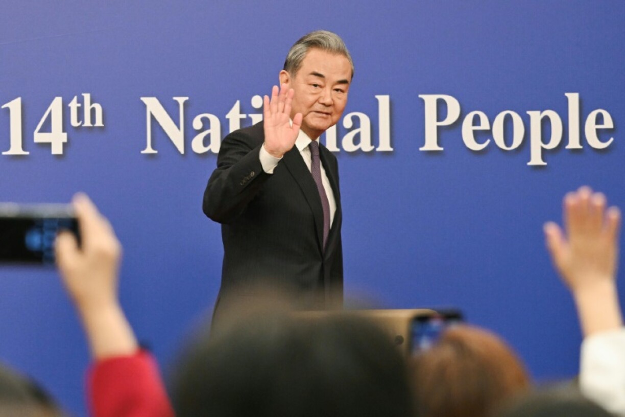 At a press conference on the sidelines of a key political meeting, China's top diplomat sought to frame Beijing as a bulwark of stability in an unstable world