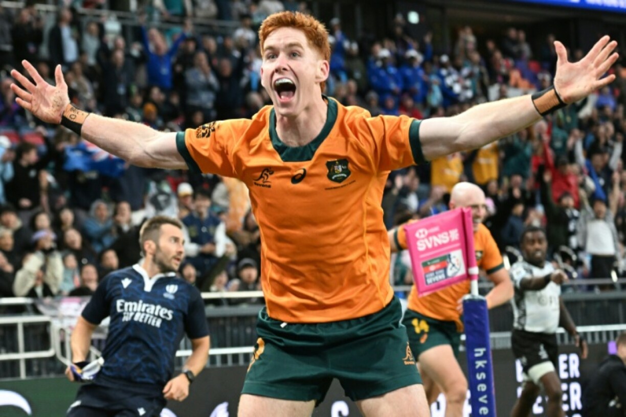 Australia's Sidney Harvey celebrates scoring the winning try in the bronze match against Fiji
