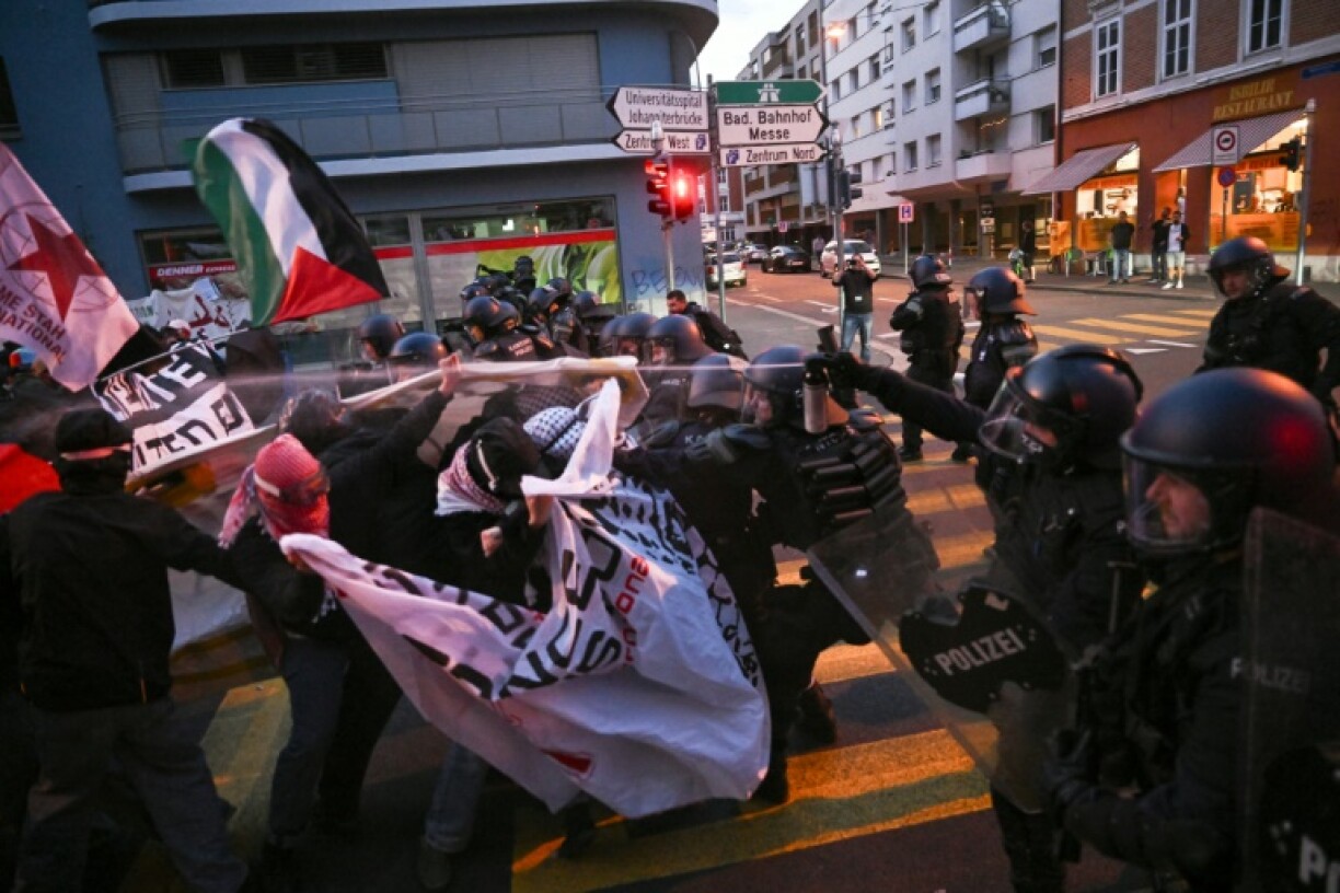 Anti-riot police officers used pepper spray to restrain activists during a demonstration against Israel's participation in Eurovision
