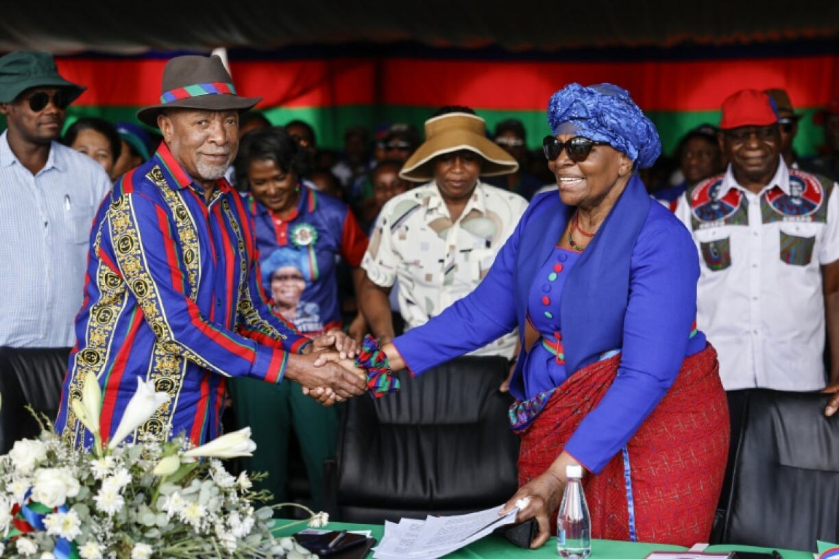 Netumbo Nandi-Ndaitwah (R) takes over from Nangolo Mbumba (L) as president of Namibia