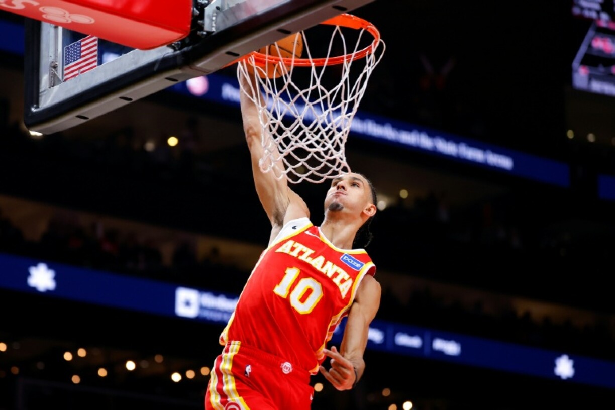 Zaccharie Risacher of the Atlanta Hawks throws down a dunk in an NBA victory over the Los Angeles Lakers