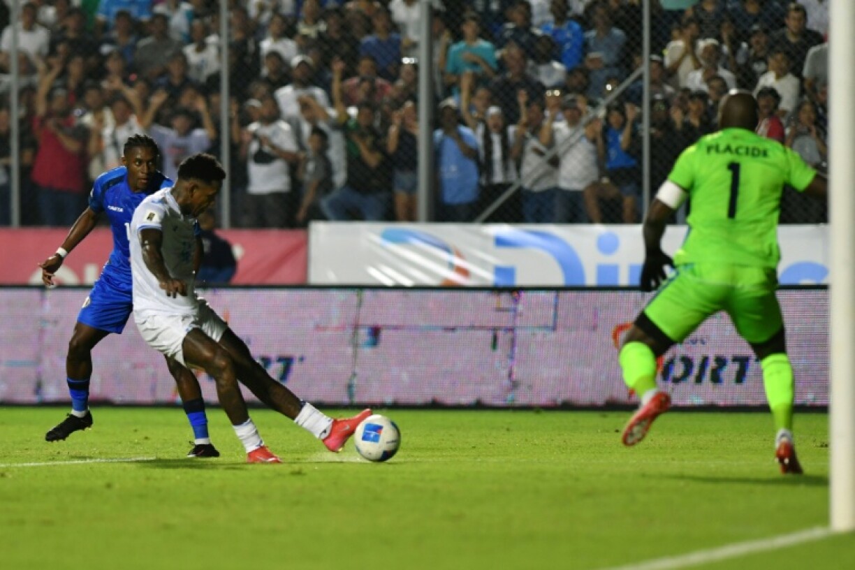 Honduras forward Romell Quioto shoots and scores a goal past Haiti goalkeeper Johny Placide