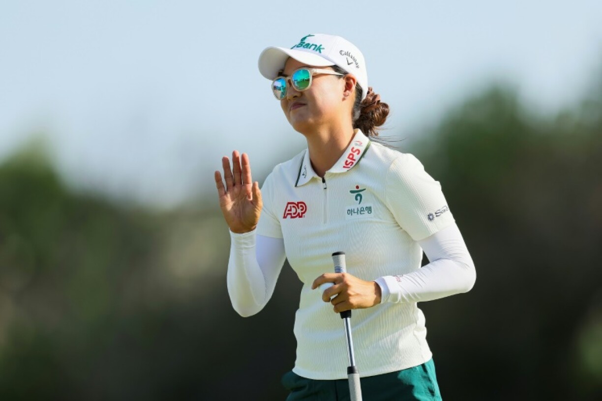 Australian Minjee Lee waves to fans after finishing the third round of the Women's PGA Championship with a four-shot lead