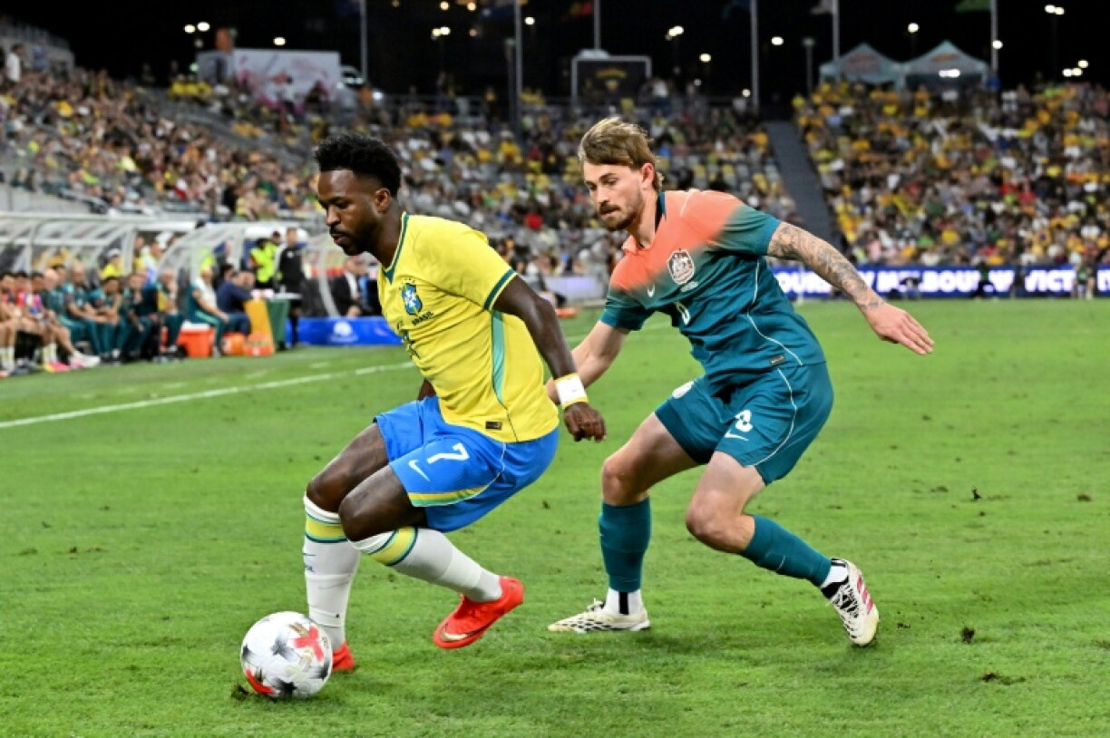Brazil's Vinicius Junior (L), pictured here playing against Australia on September 25, 2026, is among the stars on show for the first time in India this weekend.