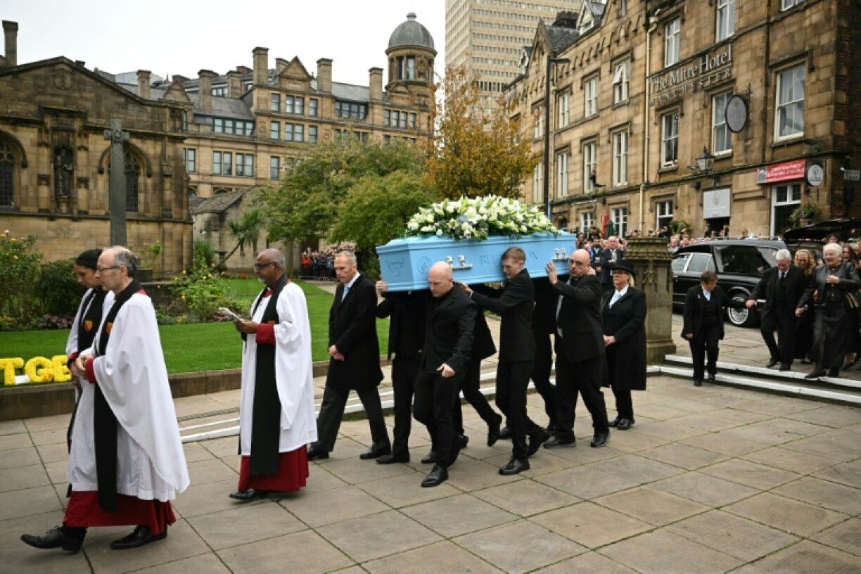 Pall-bearers carry the coffin of Ricky Hatton into Manchester Cathedral