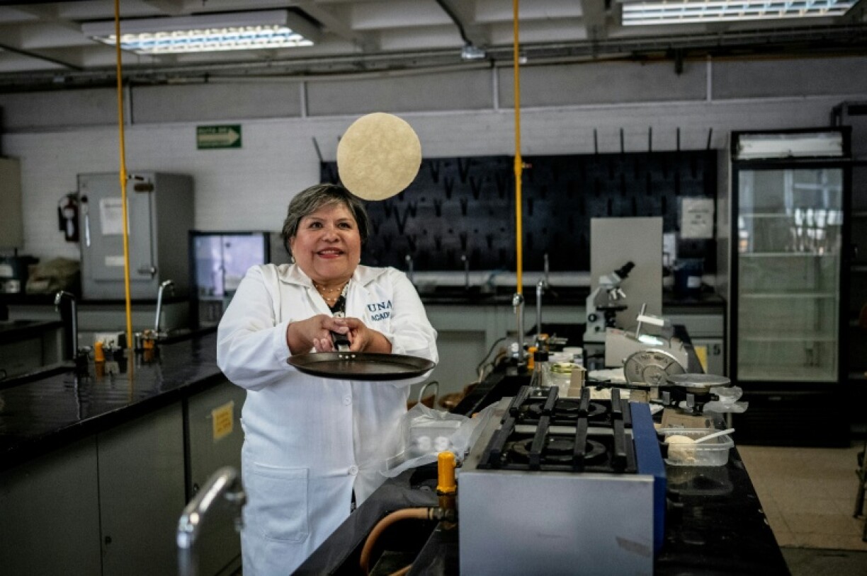 Food scientist Raquel Gomez flips a tortilla that can be kept for weeks outside a refrigerator at a university laboratory in Mexico