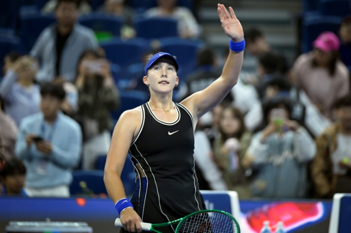 Russia's Mirra Andreeva celebrates after beating Russia’s Ekaterina Alexandrova in their women’s singles quarter-final at the China Open tennis tournament in Beijing on October 8, 2026.