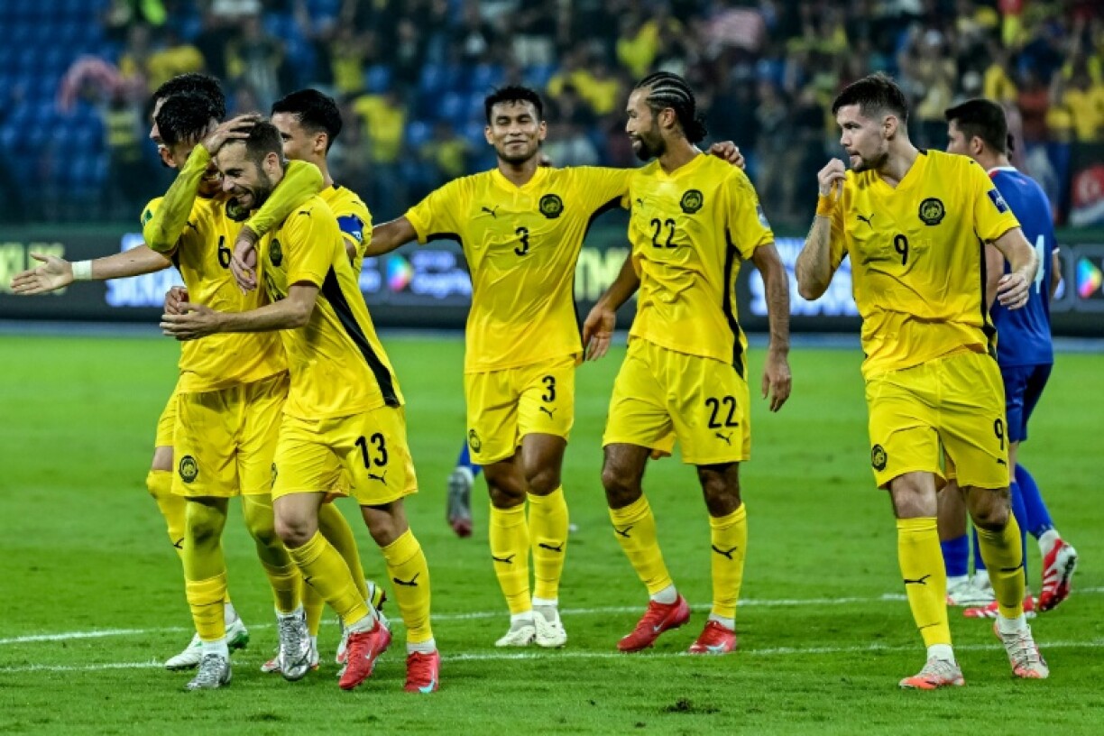 Hector Hevel (second left), who was subsequently banned by FIFA, celebrates his goal for Malaysia against Nepal in an Asian Cup qualifier in March this year