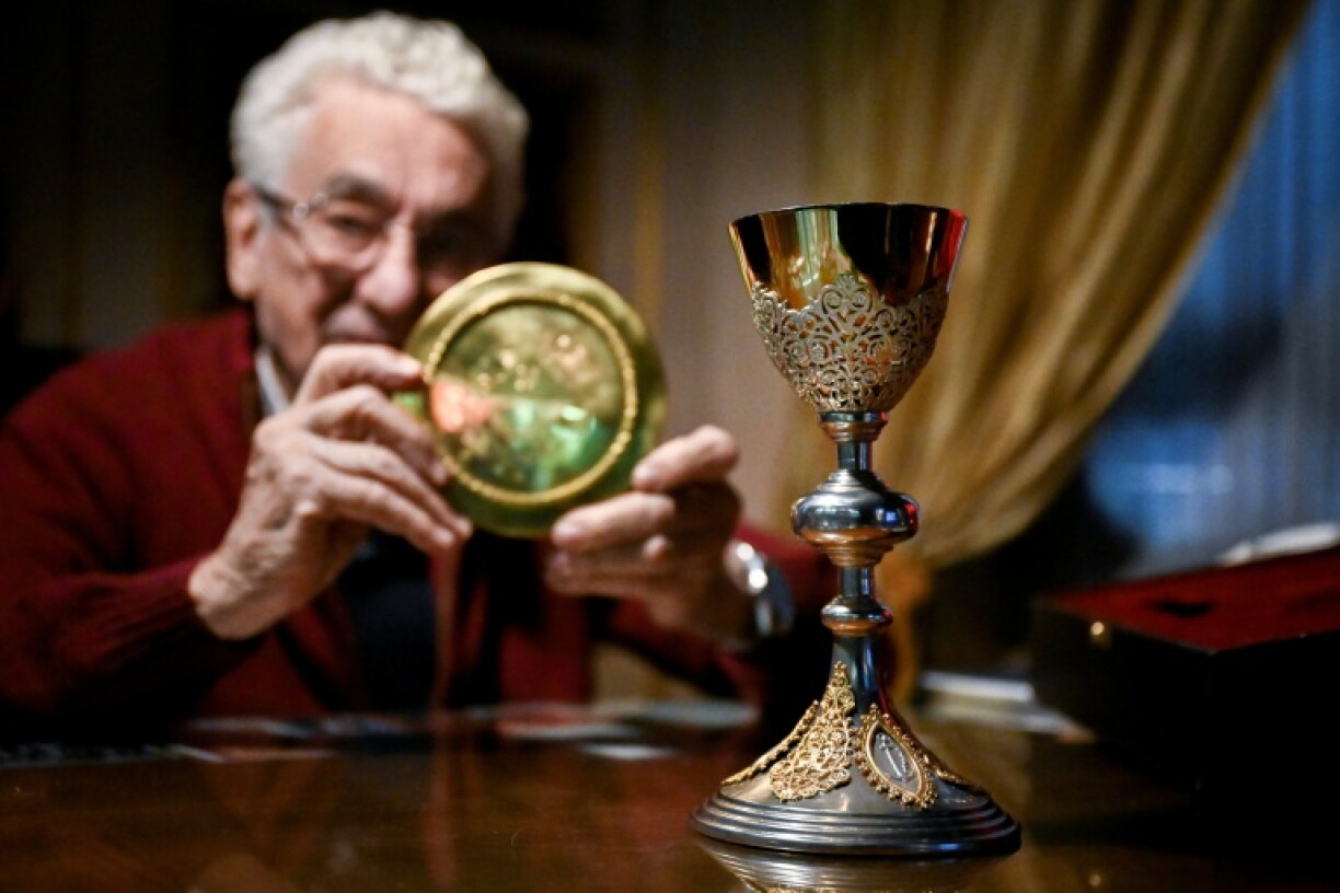 Argentine silversmith Juan Carlos Pallarols displays a paten and a chalice he crafted at his workshop in Buenos Aires to give to Pope Leo XIV during his visit next month