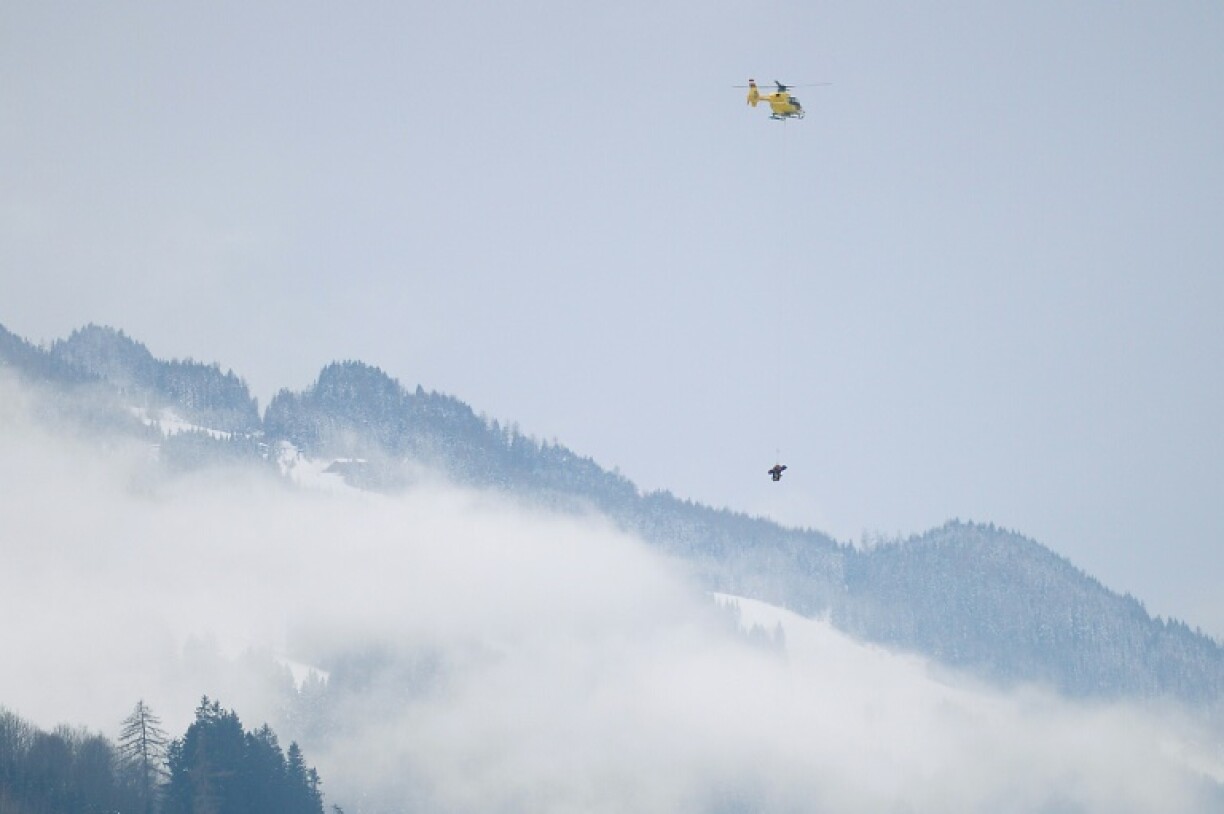 Vonn (bottom) is evacuated by a helicopter after falling during the 2013 super-G