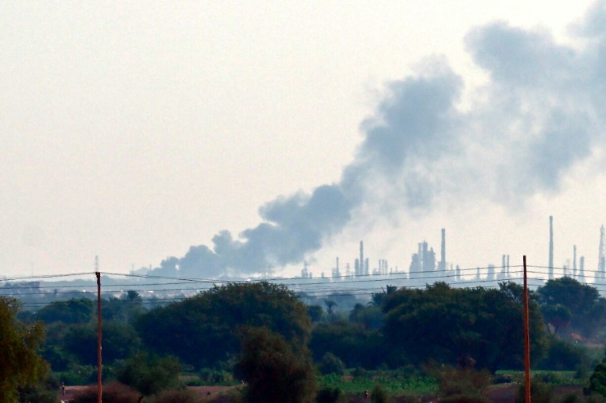 Smoke billows from an oil refinery north of Khartoum on January 15, 2025