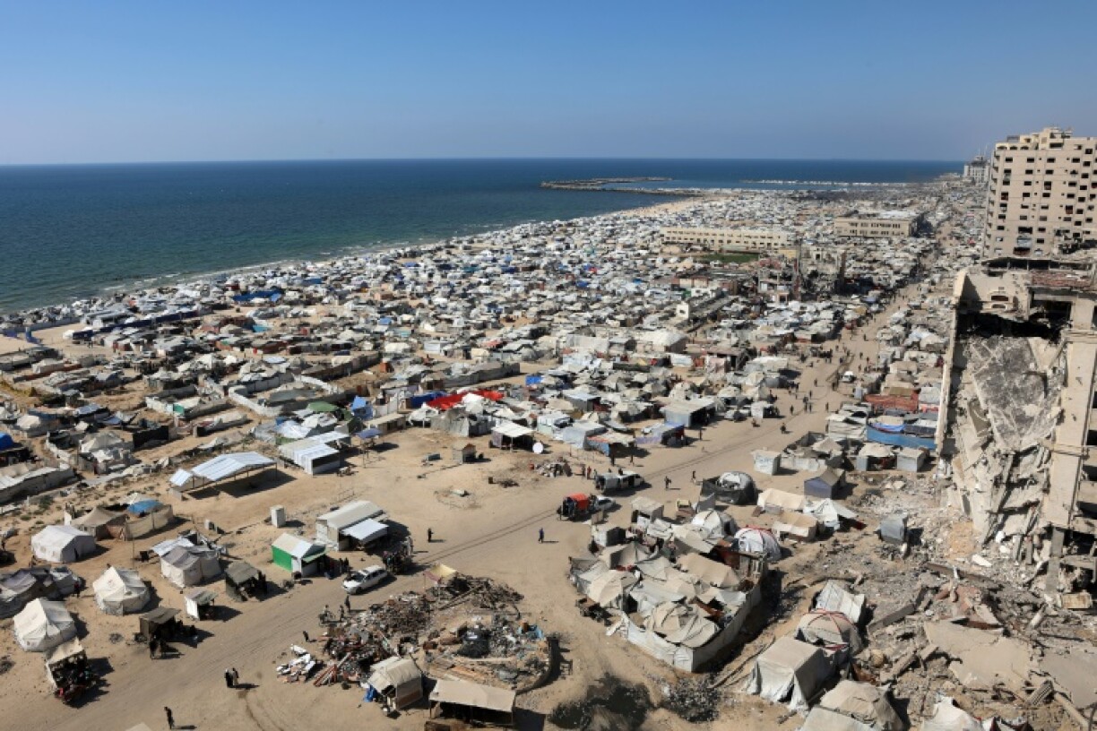 Displaced people have set up camp on the beach west of Gaza City