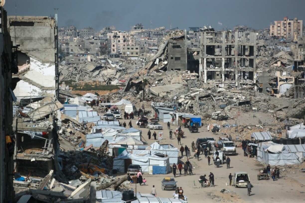 Palestinians flee Israeli bombardment in Beit Lahia in the northern Gaza Strip