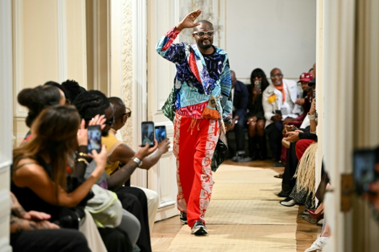 South-African designer Laduma Ngxokolo acknowledges the audience at the end of the MaXhosa Africa Women's Spring/Summer 2027 collection fashion show as part of the Paris Fashion Week, in Paris on September 28, 2026.