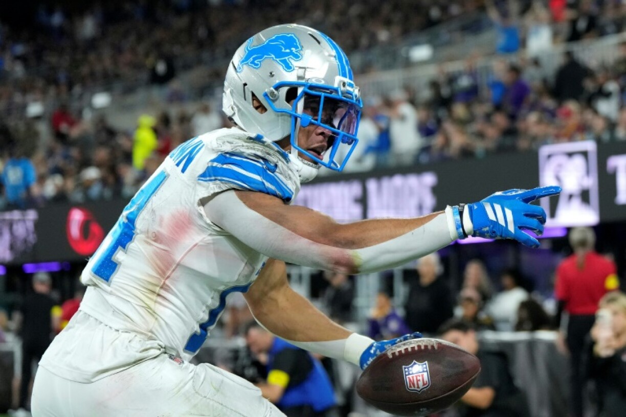 Detroit receiver Amon-Ra St. Brown celebrates a touchdown in the victory over Baltimore