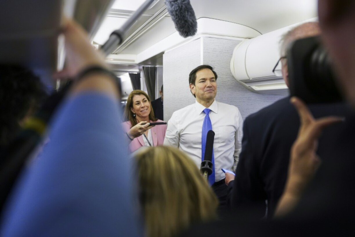 US Secretary of State Marco Rubio speaks with reporters on his plane while flying from Suriname en route to Miami