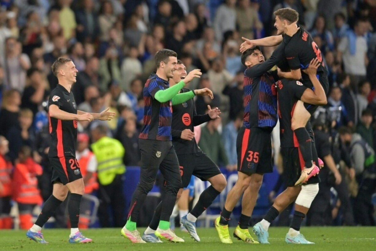 Barcelona players celebrate after winning the La Liga title for the 28th time