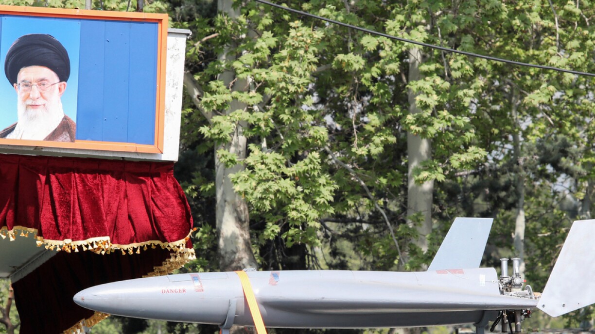 An Iranian military truck carries an Arash drone past a portrait of supreme leader Ayatollah Ali Khamenei during a military parade as part of a ceremony marking the country's annual army day in Tehran on 17 April 2024.