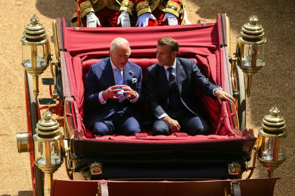 The king travelled with French President Emmanuel Macron in one carriage