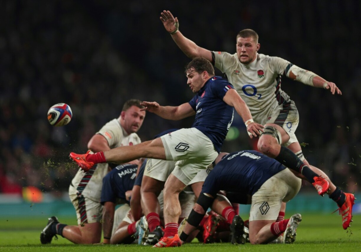 On the charge: England No 8 Tom Willis (R) tries to block a kick from Antoine Dupont (C) during a 26-25 Six Nations win over France at Twickenham