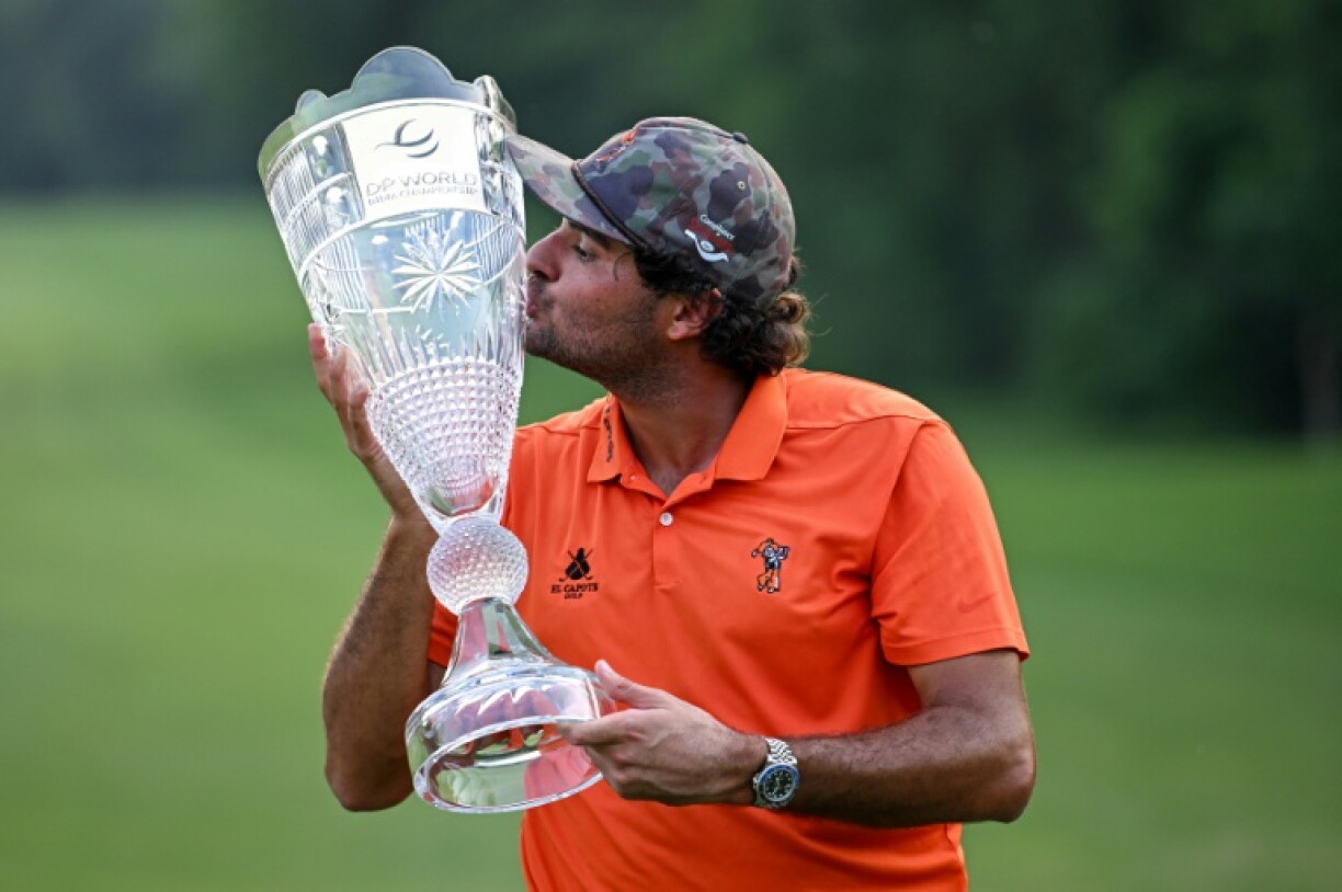 Spain's Eugenio Chacarra poses with the trophy after winning the DP World India Championship