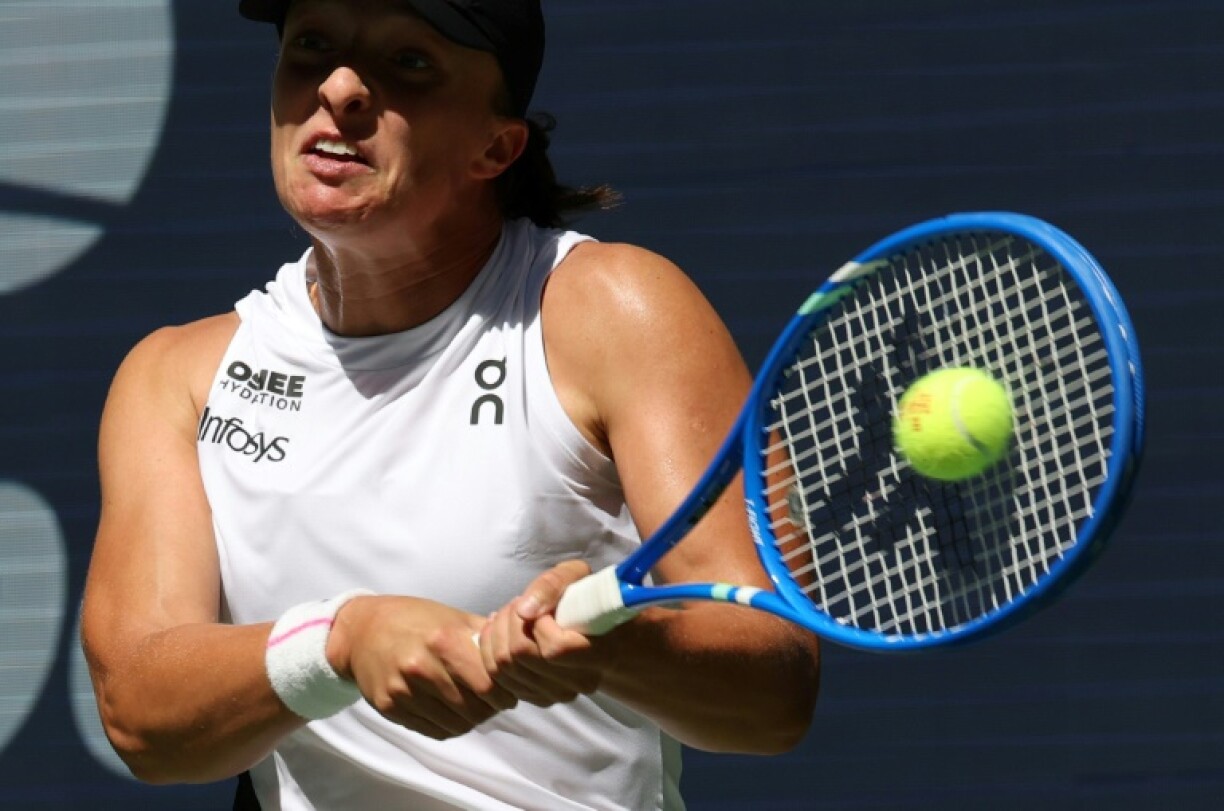 Poland's Iga Swiatek blasts a return to Emiliana Arango in a straight sets first round win at the US Open