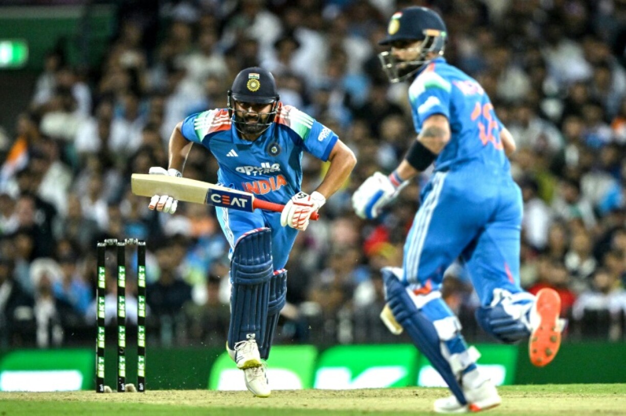 India's Rohit Sharma (L) and Virat Kohli run between the wicket during the third one-day international against Australia