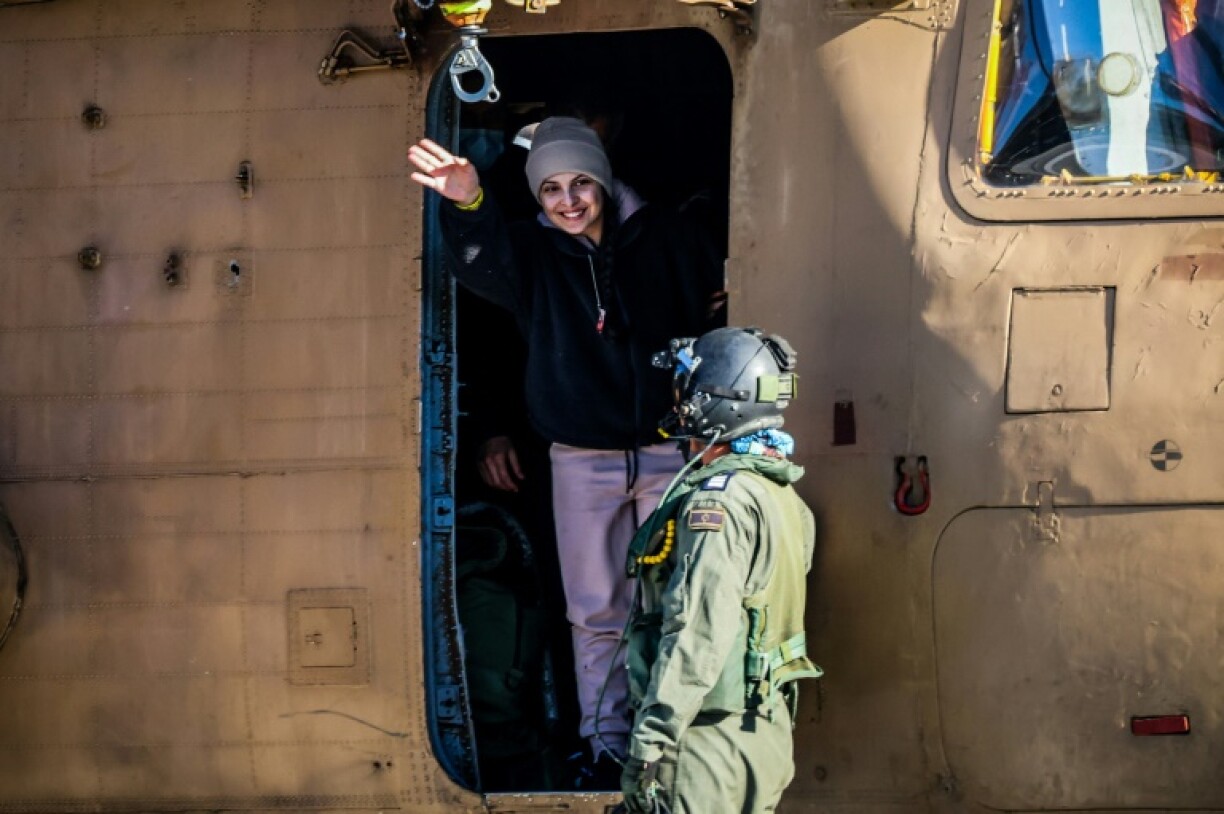 Newly released Israeli hostage Daniella Gilboa waves as she leaves a military helicopter at a central Israeli hospital