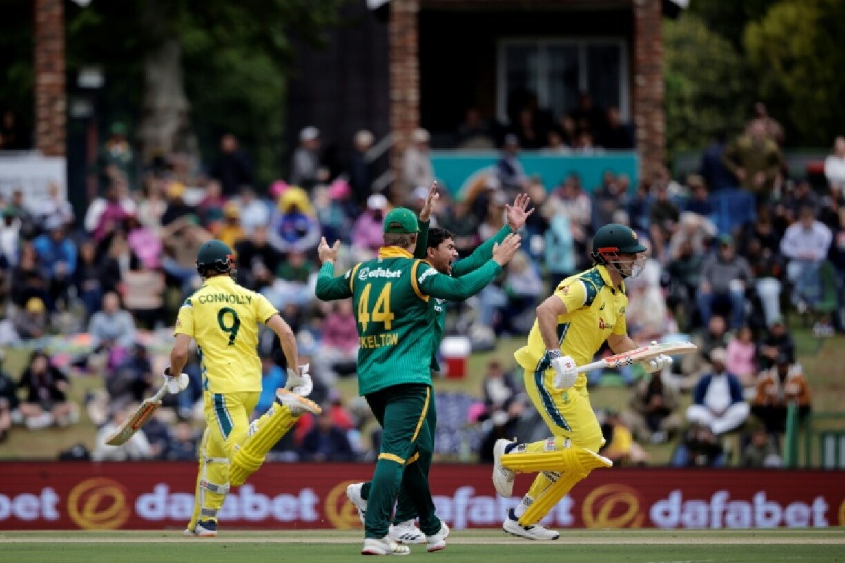 South Africa's Bjorn Fortuin (3rd L) celebrates the wicket of Australia's Mitchell Marsh during the third one-day international (ODI) at Senwes Park in Potchefstroom