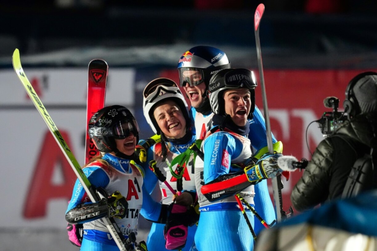 (From L) Italy's Giorgia Collomb, Lara Della Mea, Alex Vinatzer and Filippo Della Vite after victory in the world mixed team parallel