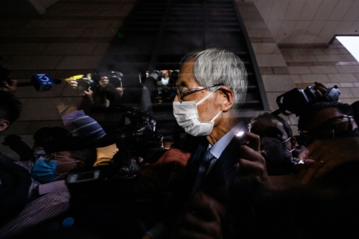 Former lawmaker and barrister Martin Lee leaves a court in Hong Kong after being found guilty of organising an unauthorised assembly