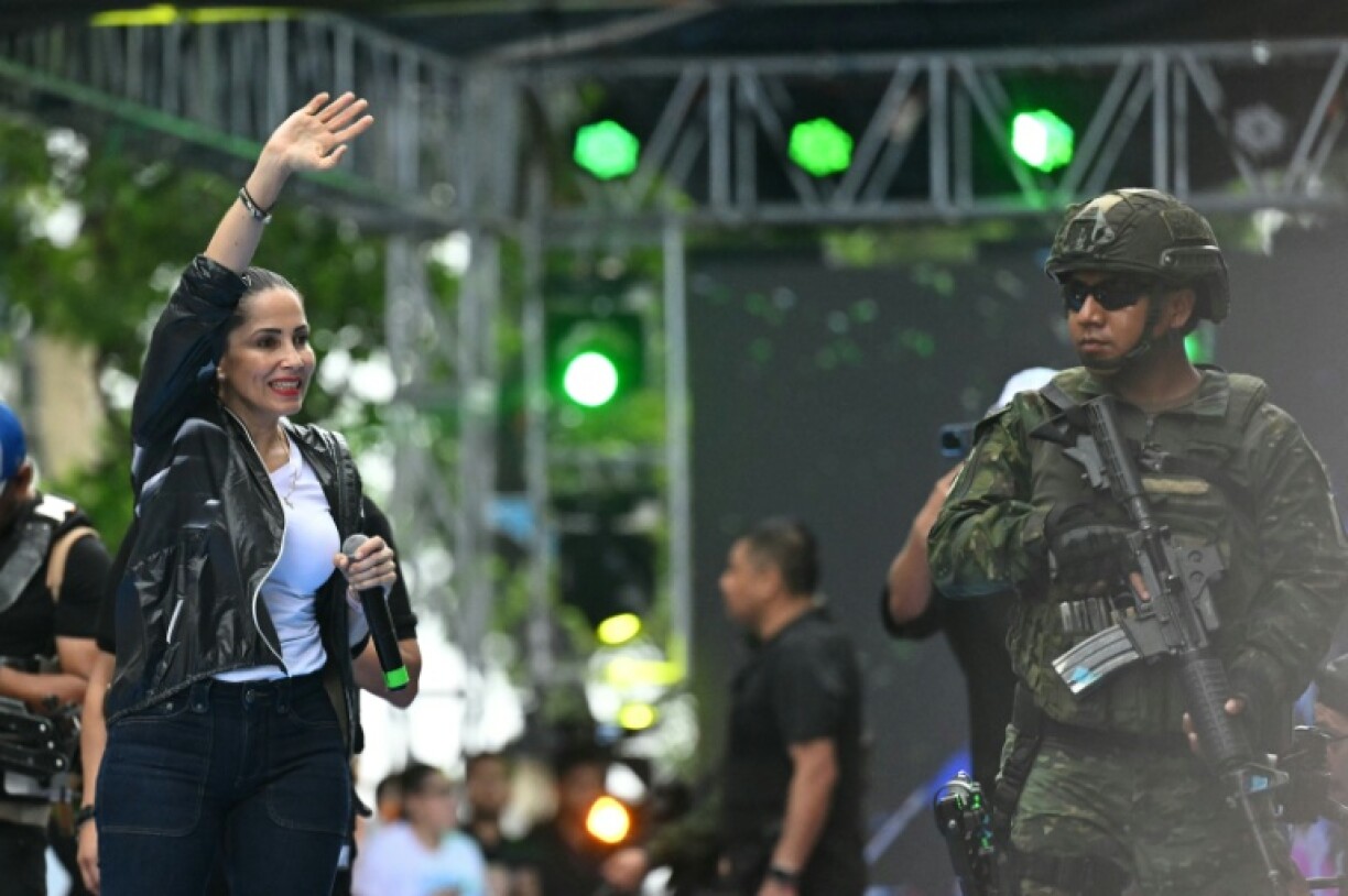 Ecuador's presidential candidate for the Citizen Revolution Movement (Movimiento Revolución Ciudadana), Luisa González, waves to supporters during her campaign closing rally in Guayaquil, Guayas province, Ecuador on February 6, 2025.