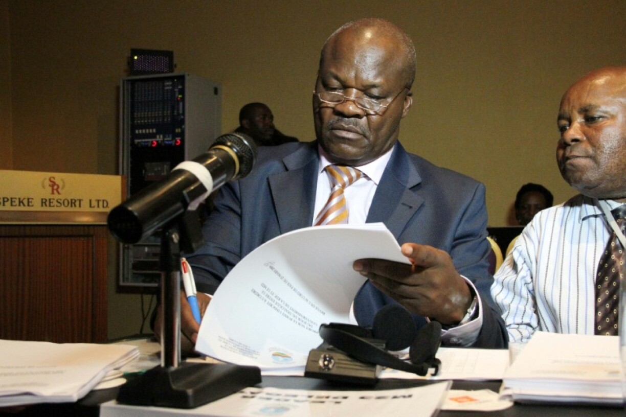 Lumbala (left) is accused of complicity in crimes against humanity