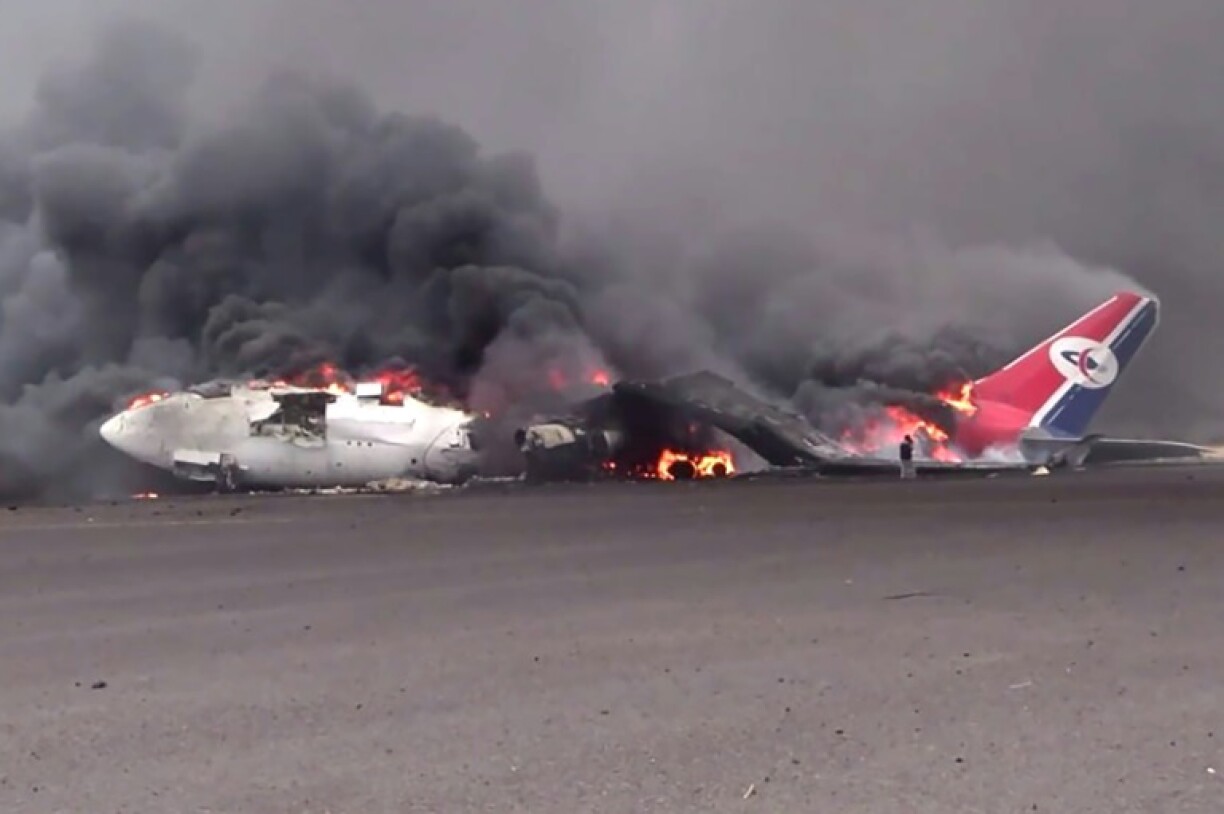 An aircraft burns after the Israeli strikes on Sanaa airport, in this picture released by Huthi news agency SABA