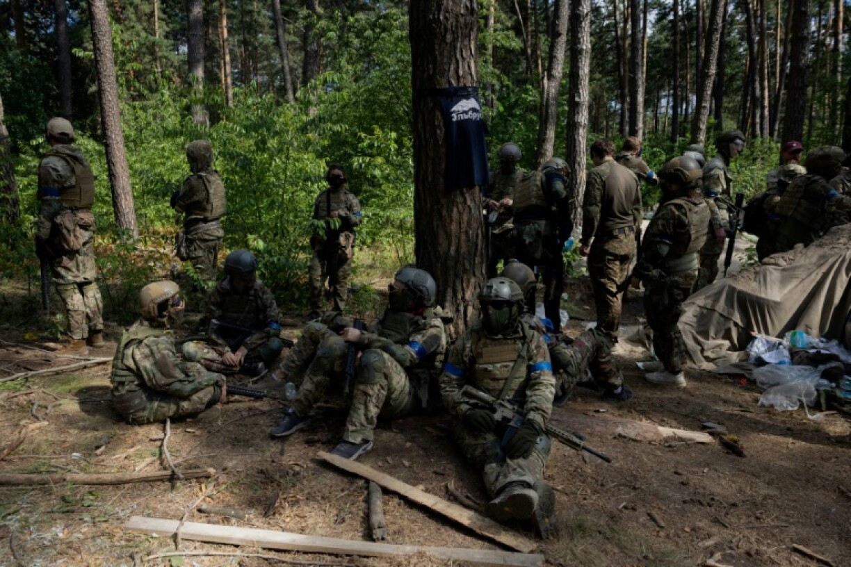 Civilians wearing military uniforms take part intraining by Ukraine's Third Separate Assault Brigade in the Kyiv region on July 12, 2025
