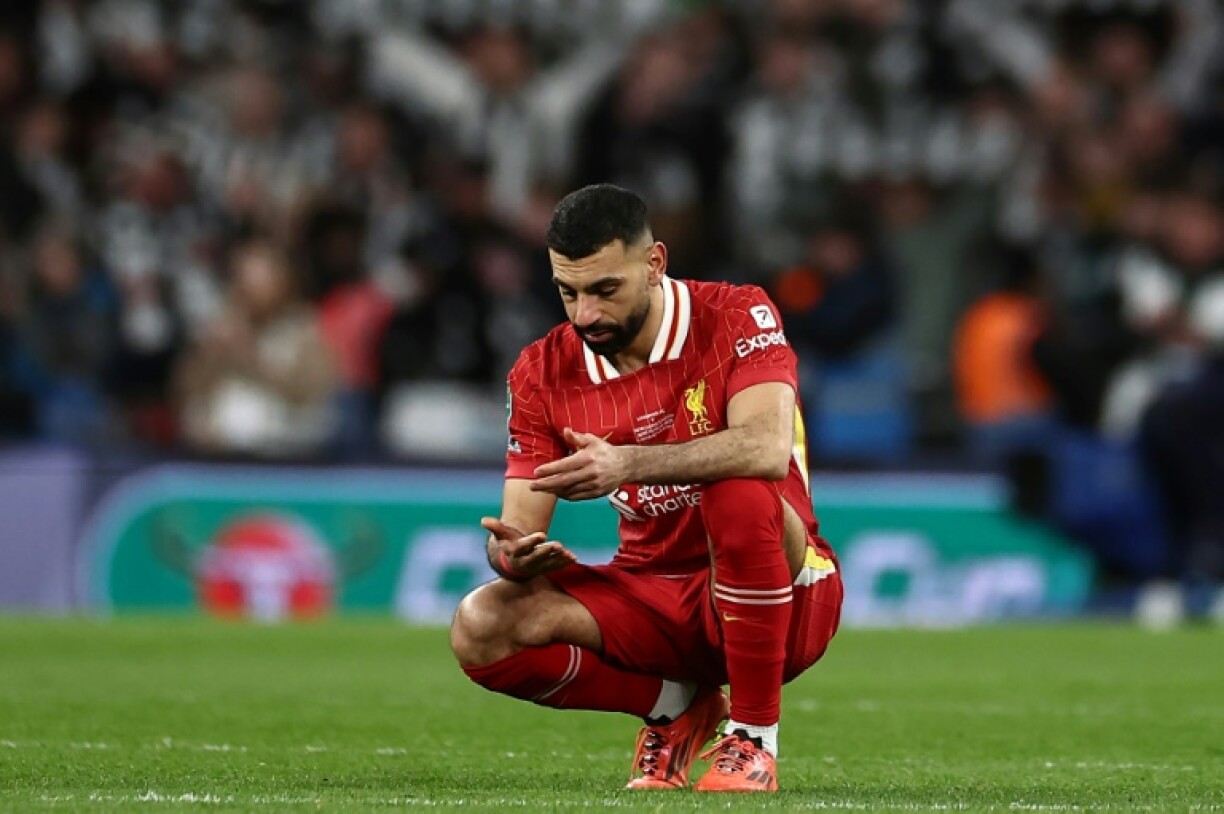 Liverpool forward Mohamed Salah reacts to the team's League Cup defeat by Newcastle