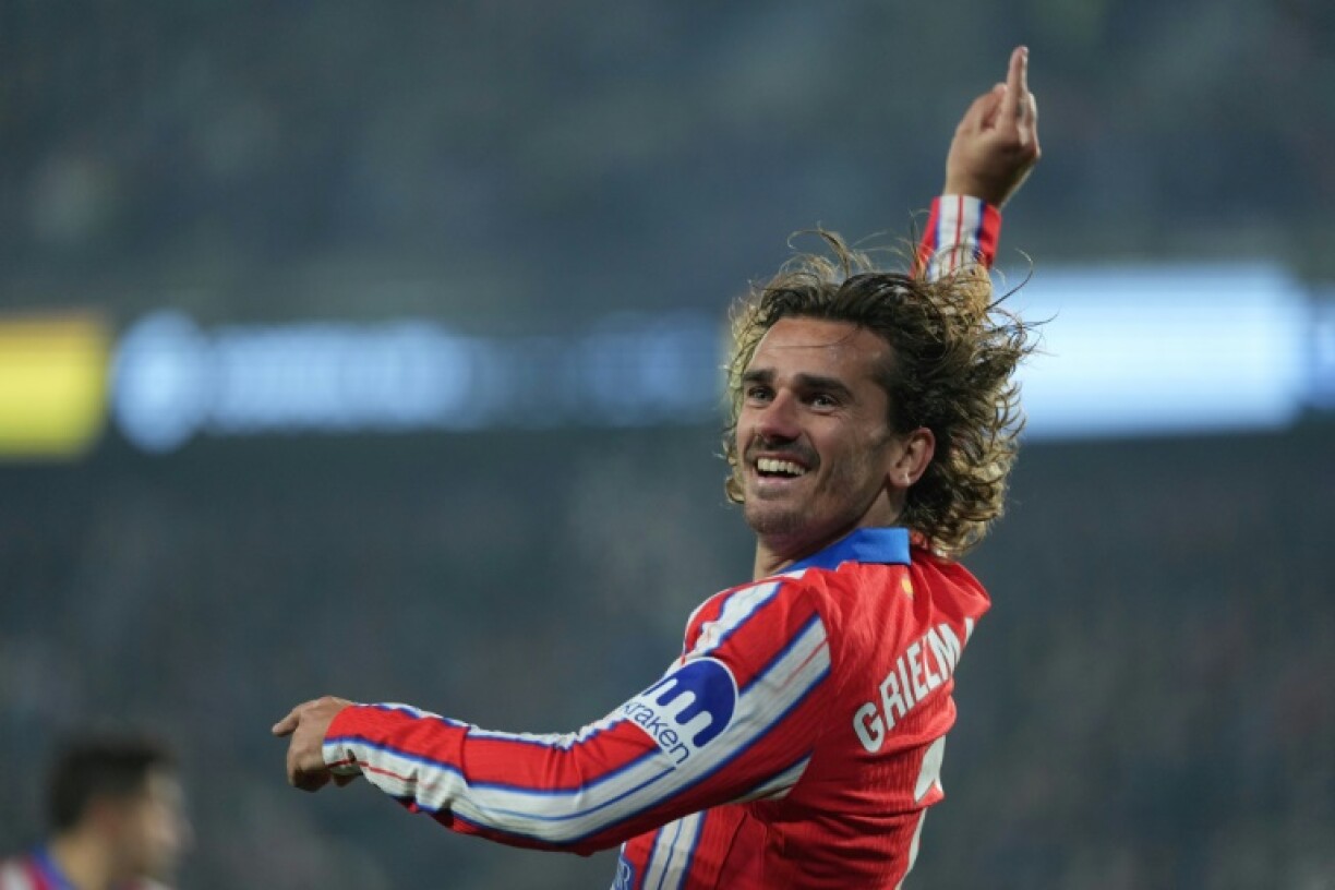 Atletico Madrid's French forward Antoine Griezmann celebrates after scoring his team's sensational fourth goal