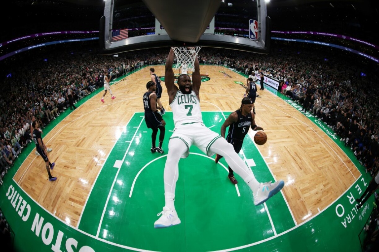 Boston's Jaylen Brown reacts after making a slam dunk in the Celtics' NBA playoff victory over Orlando