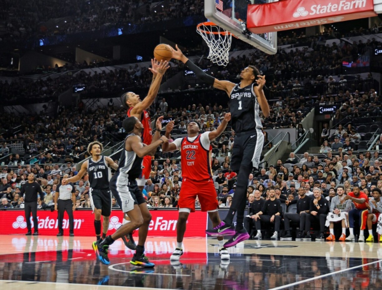 Victor Wembanyama of the San Antonio Spurs bocks the shot of Micah Peavy in the Spurs' NBA victory over the New Orleans Pelicans