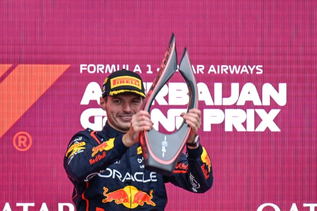 Max Verstappen collects his trophy in Baku