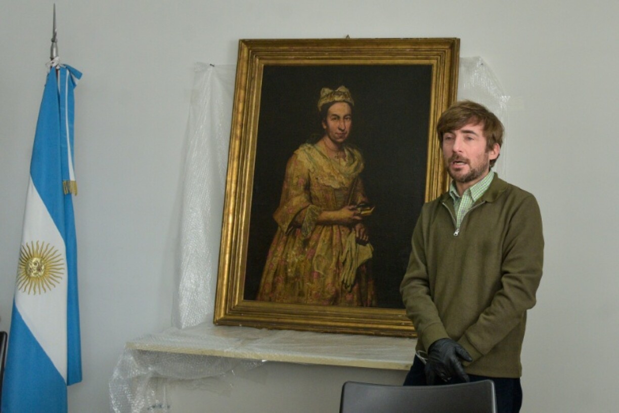 Art expert Ariel Bassano with the Nazi-looted 'Portrait of a Lady' after it was retrieved by Argentine authorities from the daughter of an SS officer in the resort of Mar del Plata
