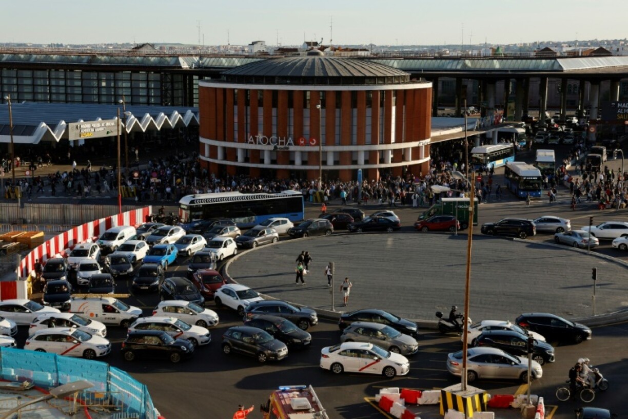 A traffic jam in front of Madrid's Atocha rail station as the city battles a massive power cut