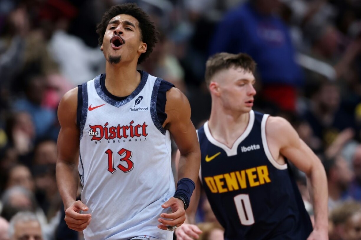 Jordan Poole of the Washington Wizards celebrates a basket in the Wizards' NBA victory over the Denver Nuggets