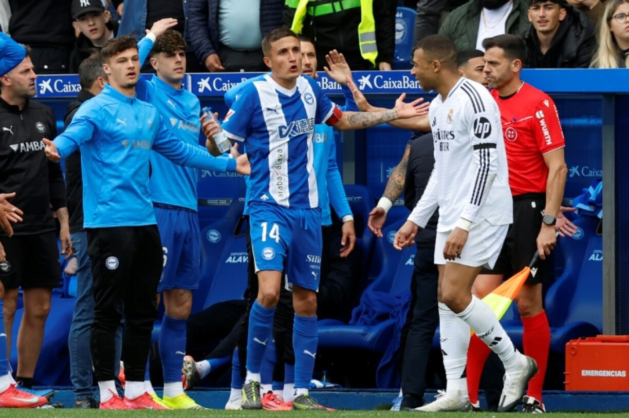 Real Madrid's French forward Kylian Mbappe (R) was sent off for an ugly lunge at Antonio Blanco