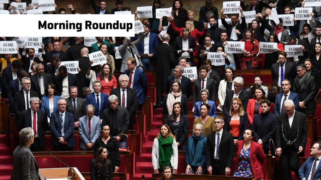 Members of Parliament of left-wing coalition NUPES (New People's Ecologic and Social Union) hold placards during the speech of France's Prime Minister Elisabeth Borne (C), as she confirms to force through pension law without parliament vote during a session on the government's pension reform at the lower house National Assembly, in Paris on March 16, 2023.