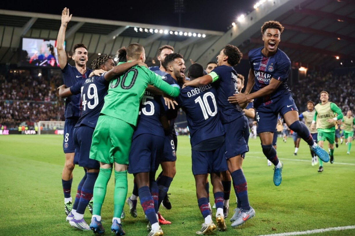 Paris Saint-Germain players celebrate after beating Tottenham Hotspur on penalties on Wednesday to win the UEFA Super Cup