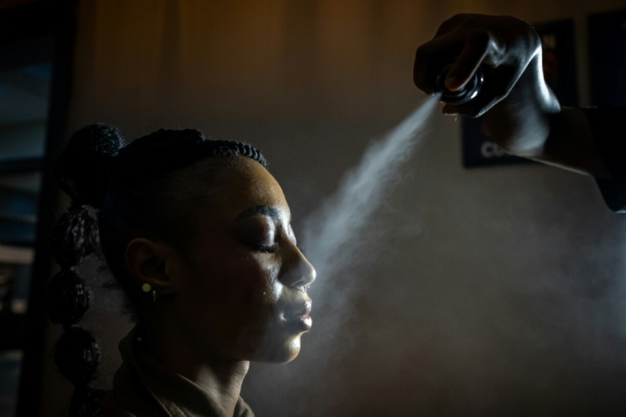 Models prepare backstage at Nigeria Fashion Week
